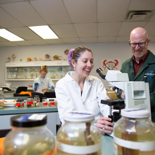 VIU student and professor at the microscope