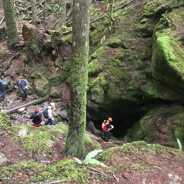 Students exploring the cave system at Horne Lake during a GEOL401 field trip