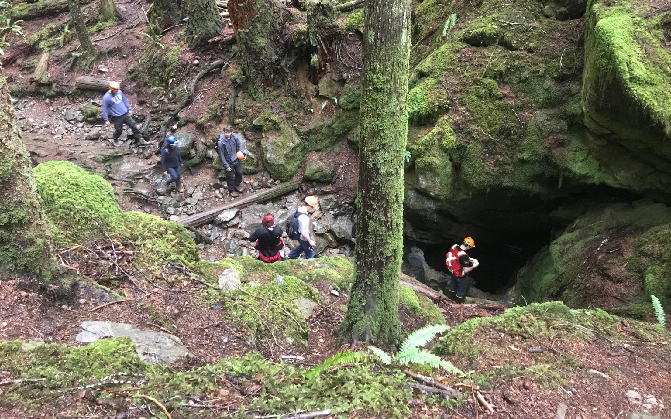 Students exploring the cave system at Horne Lake during a GEOL401 field trip